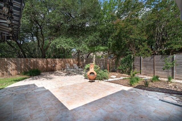 3801 Oak Creek Dr, Austin, TX 78727 - fenced backyard featuring a patio