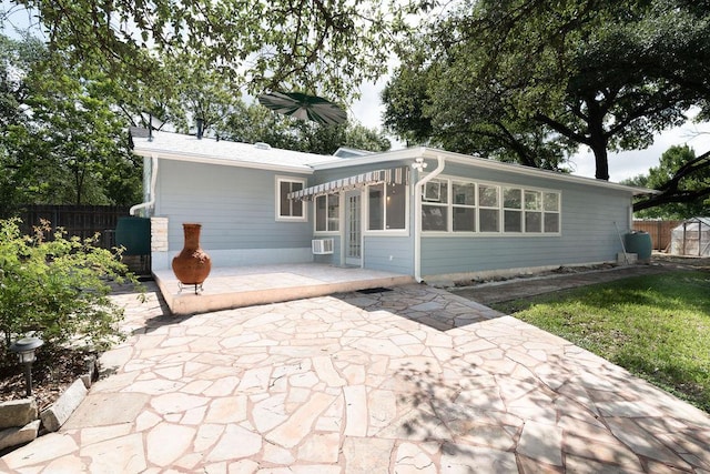 3801 Oak Creek Dr, Austin, TX 78727 - view of front of house featuring a patio, cooling unit, and a sunroom