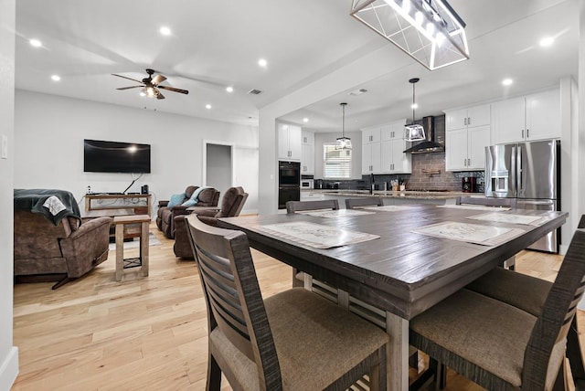 110 Les Ln, Smithville, TX 78957 - dining space featuring light wood-style flooring, recessed lighting, and a ceiling fan