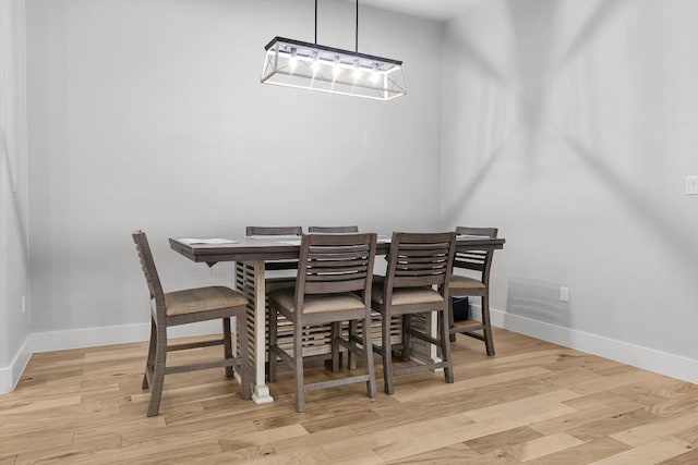 110 Les Ln, Smithville, TX 78957 - dining area with light wood finished floors and a chandelier