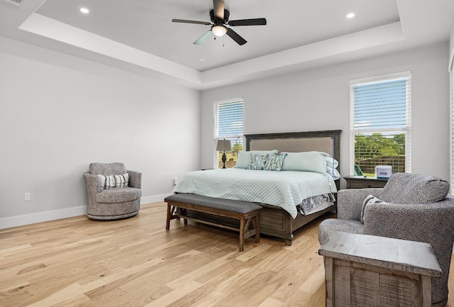 110 Les Ln, Smithville, TX 78957 - bedroom featuring a tray ceiling, light wood-style floors, recessed lighting, and ceiling fan