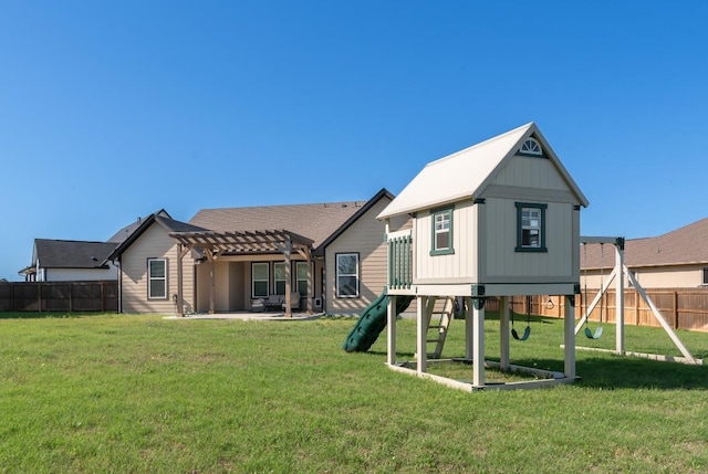 110 Les Ln, Smithville, TX 78957 - back of property featuring a playground, a pergola, a fenced backyard, and a patio area