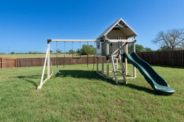 110 Les Ln, Smithville, TX 78957 - view of play area with a fenced backyard