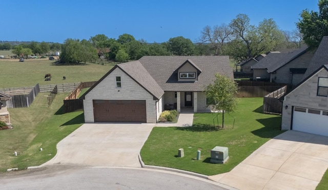 110 Les Ln, Smithville, TX 78957 - view of front of house featuring concrete driveway, a garage, covered porch, stone siding, and roof with shingles