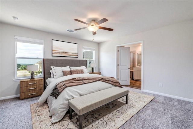 221 Delaware Mountains Ter, Dripping Springs, TX 78620 - bedroom featuring light carpet, ceiling fan, and ensuite bathroom