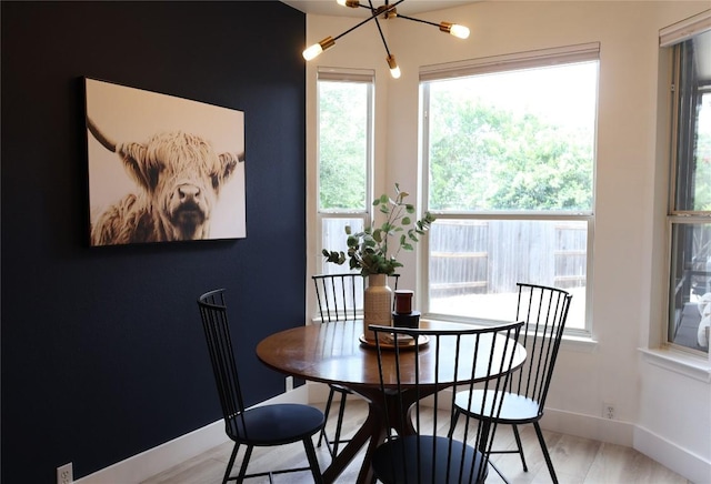 1654 Belvedere Pl, Round Rock, TX 78665 - dining room with a chandelier and light wood-type flooring