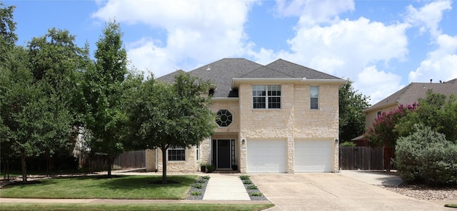 1654 Belvedere Pl, Round Rock, TX 78665 - traditional-style home with stone siding, concrete driveway, a garage, and a shingled roof