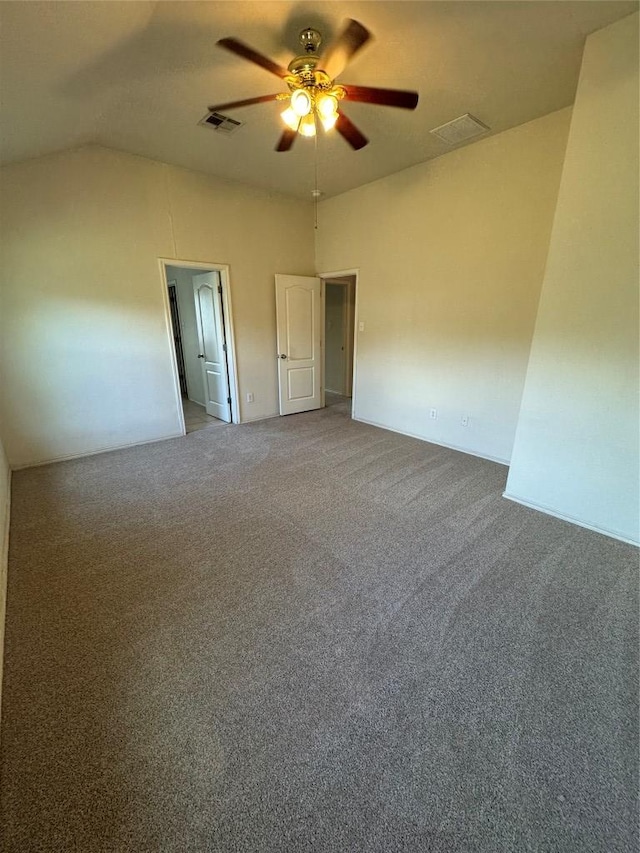 257 Firwood N, Kyle, TX 78640 - unfurnished bedroom featuring carpet flooring, vaulted ceiling, and ceiling fan