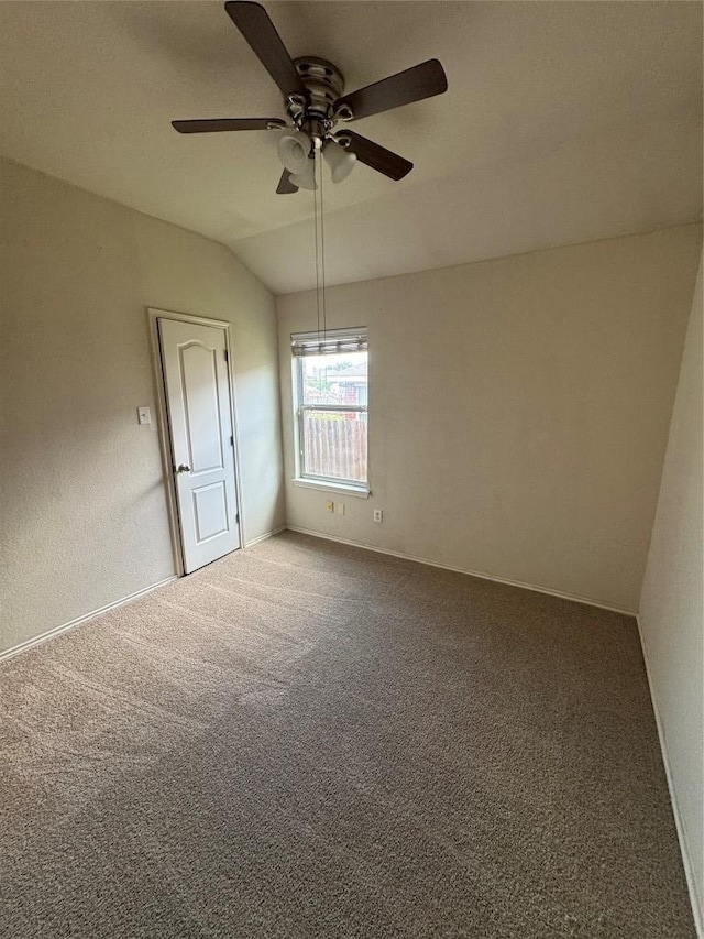 257 Firwood N, Kyle, TX 78640 - carpeted empty room featuring a ceiling fan and vaulted ceiling