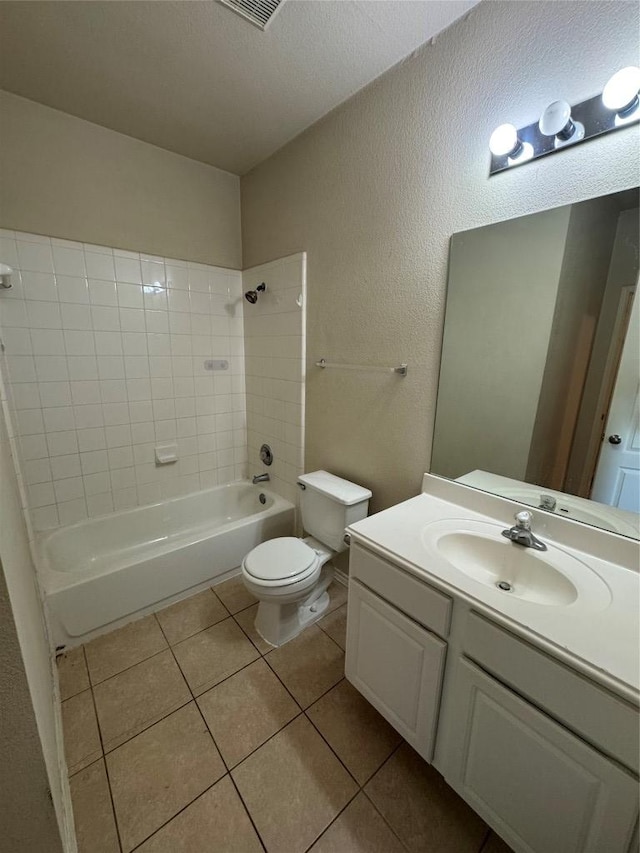257 Firwood N, Kyle, TX 78640 - bathroom with vanity, tile patterned floors, washtub / shower combination, and a textured wall