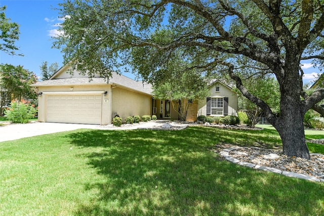 307 Dove Hollow Trl, Georgetown, TX 78633 - view of front of house featuring an attached garage, stucco siding, a front lawn, and concrete driveway