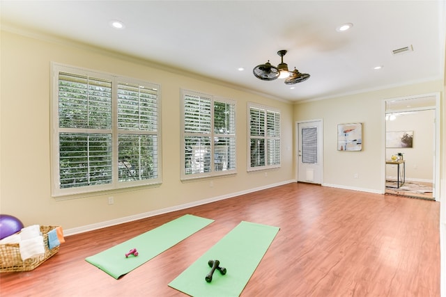 307 Dove Hollow Trl, Georgetown, TX 78633 - exercise area with ornamental molding, wood finished floors, recessed lighting, and ceiling fan