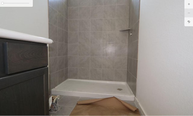 2008 Saco St, Leander, TX 78641 - full bathroom with a tile shower and tile patterned floors