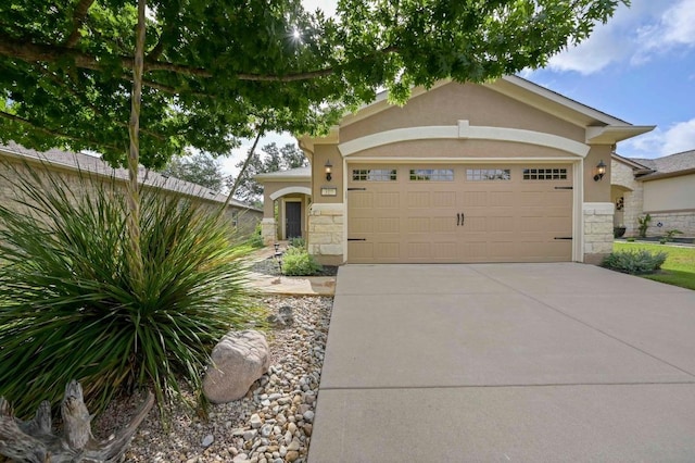 319 Salado Creek Ln, Georgetown, TX 78633 - view of front of home with stone siding, a garage, driveway, and stucco siding