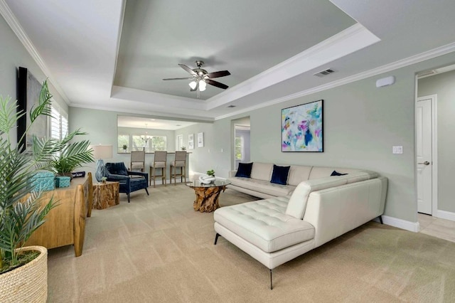 319 Salado Creek Ln, Georgetown, TX 78633 - living area featuring a raised ceiling, light carpet, crown molding, and ceiling fan