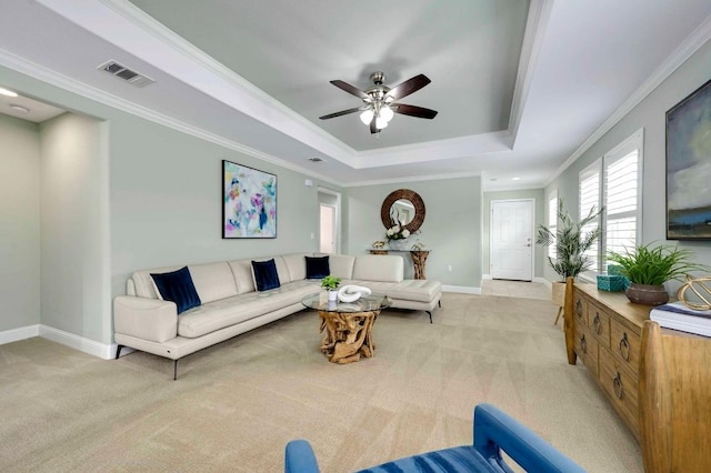 319 Salado Creek Ln, Georgetown, TX 78633 - living area with light colored carpet, a raised ceiling, a ceiling fan, and crown molding