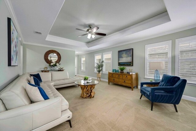 319 Salado Creek Ln, Georgetown, TX 78633 - living area with a tray ceiling, crown molding, a ceiling fan, and light colored carpet