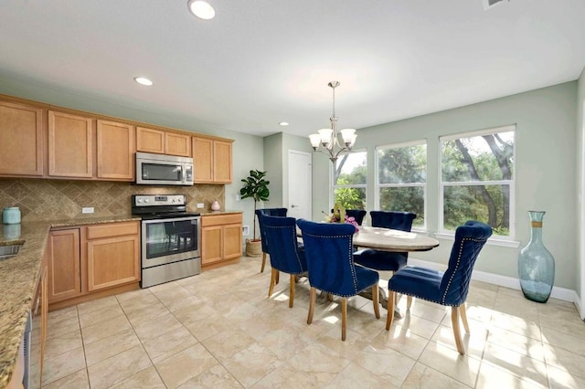 319 Salado Creek Ln, Georgetown, TX 78633 - kitchen with stainless steel appliances, a chandelier, tasteful backsplash, hanging light fixtures, and recessed lighting