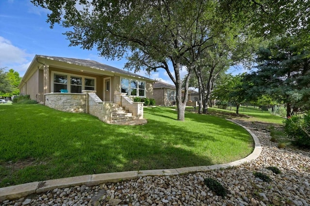 319 Salado Creek Ln, Georgetown, TX 78633 - back of house featuring a yard and stucco siding