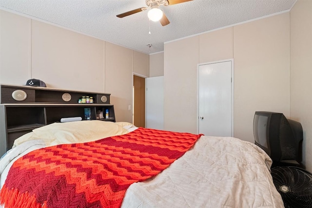 1231 Peach Creek Rd, Waelder, TX 78959 - bedroom with a textured ceiling, ornamental molding, and ceiling fan