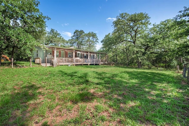 1231 Peach Creek Rd, Waelder, TX 78959 - view of green lawn featuring a wooden deck
