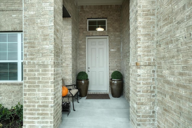 187 Glass Mountains Way, Dripping Springs, TX 78620 - property entrance featuring brick siding and covered porch