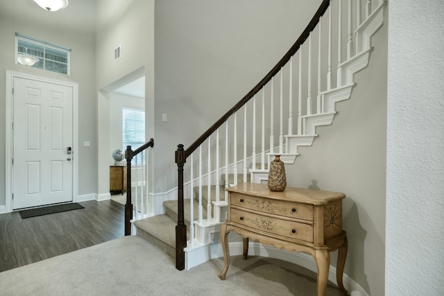187 Glass Mountains Way, Dripping Springs, TX 78620 - foyer featuring wood finished floors, stairs, and a towering ceiling