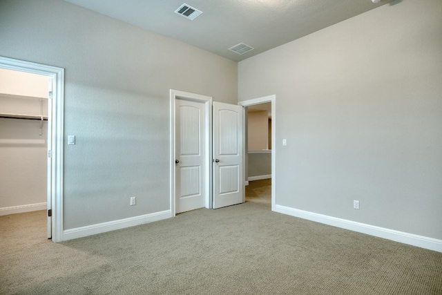 187 Glass Mountains Way, Dripping Springs, TX 78620 - unfurnished bedroom with carpet floors and a spacious closet