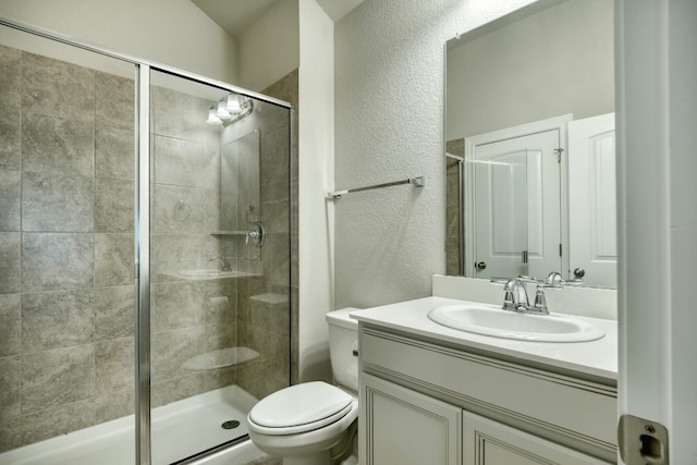 187 Glass Mountains Way, Dripping Springs, TX 78620 - bathroom featuring a textured wall, a stall shower, and vanity