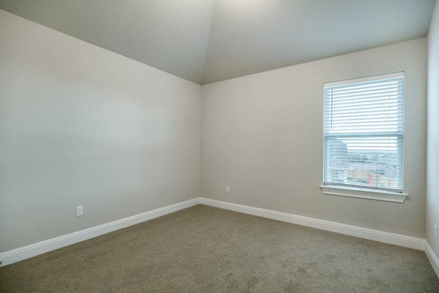187 Glass Mountains Way, Dripping Springs, TX 78620 - carpeted spare room featuring baseboards and lofted ceiling