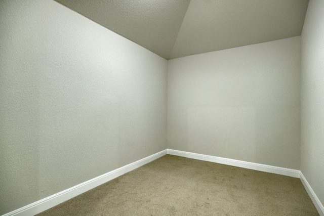 187 Glass Mountains Way, Dripping Springs, TX 78620 - spare room with carpet floors and vaulted ceiling