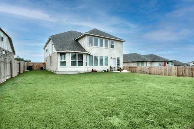 187 Glass Mountains Way, Dripping Springs, TX 78620 - back of house with a fenced backyard and a shingled roof