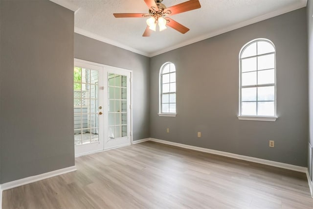 3111 Tom Green St Unit 105, Austin, TX 78705 - unfurnished room with wood finished floors, crown molding, a ceiling fan, and a textured ceiling