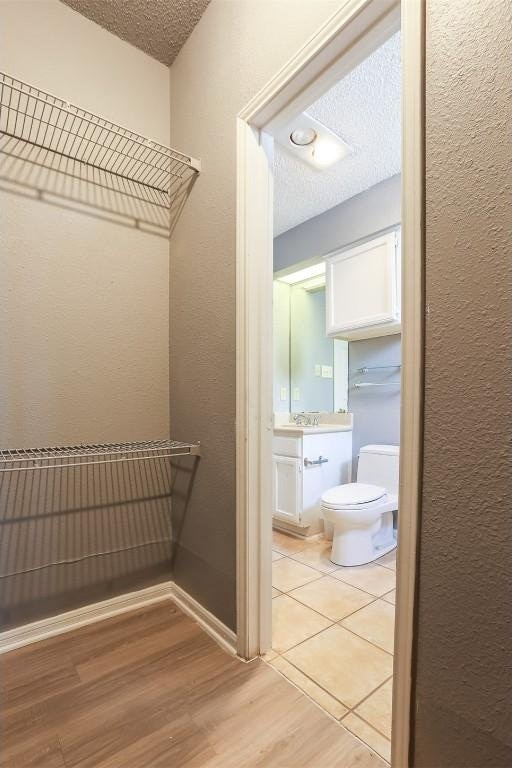 3111 Tom Green St Unit 105, Austin, TX 78705 - walk in closet with light wood finished floors