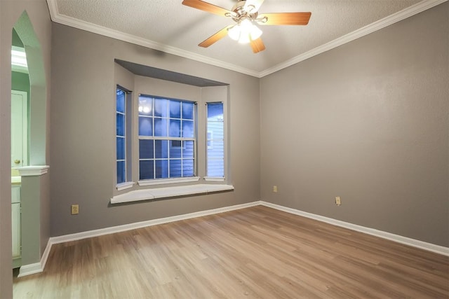 3111 Tom Green St Unit 105, Austin, TX 78705 - spare room with wood finished floors, a ceiling fan, ornamental molding, and a textured ceiling