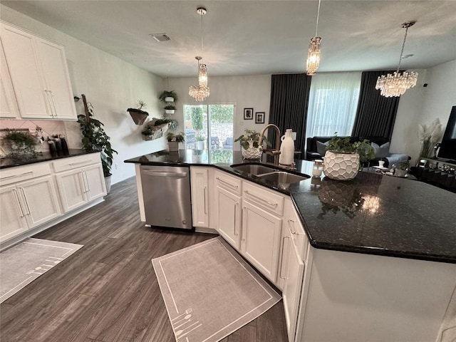 1121 Arbor Acres Loop, Leander, TX 78641 - kitchen with dishwasher, a chandelier, dark wood-style flooring, and white cabinets