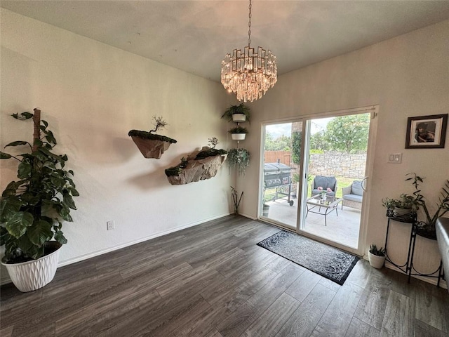 1121 Arbor Acres Loop, Leander, TX 78641 - unfurnished dining area featuring dark wood finished floors and a chandelier