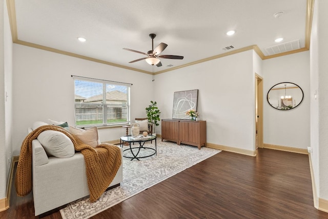 7606 Hickman St, Temple, TX 76502 - living area featuring wood finished floors, ornamental molding, a ceiling fan, recessed lighting, and a chandelier