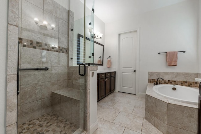 114 Reflection Bay Ct, Austin, TX 78738 - full bath featuring a bath, vanity, a shower stall, and tile patterned floors
