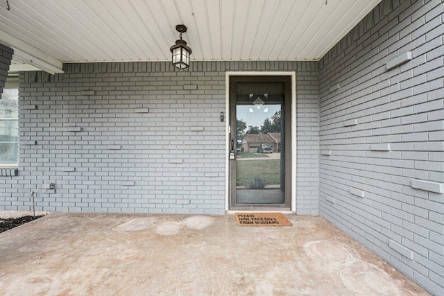 3806 Las Cienega Blvd, Temple, TX 76502 - doorway to property with brick siding and a patio area