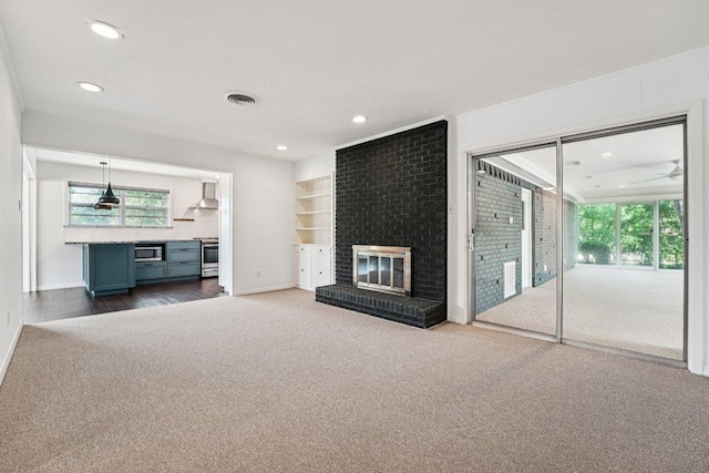 3806 Las Cienega Blvd, Temple, TX 76502 - unfurnished living room with carpet floors, recessed lighting, and a fireplace