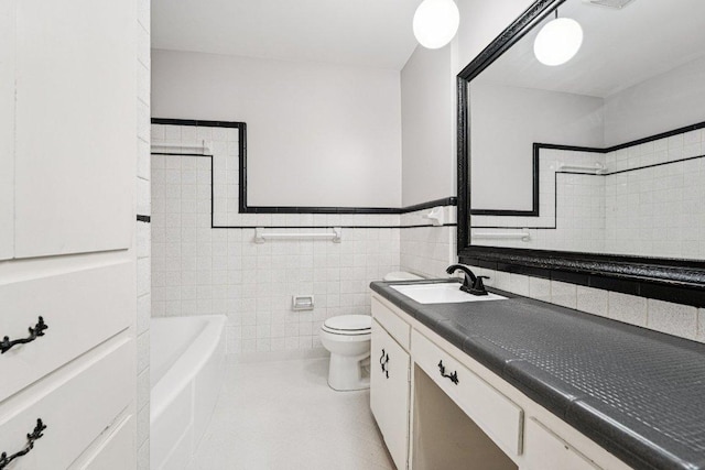 3806 Las Cienega Blvd, Temple, TX 76502 - full bath with vanity, tile walls, and a wainscoted wall