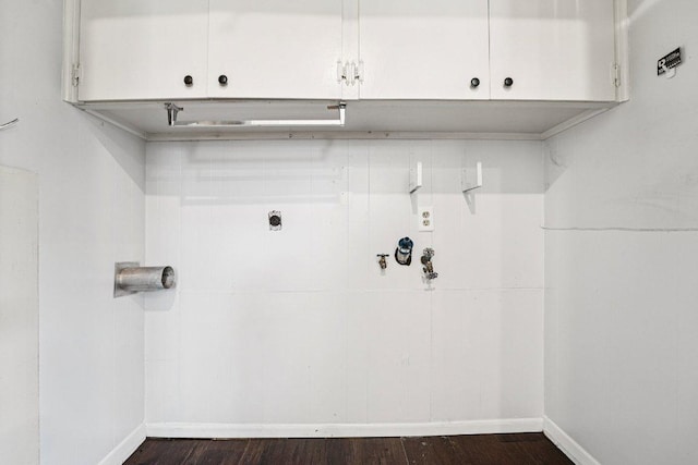 3806 Las Cienega Blvd, Temple, TX 76502 - laundry area featuring cabinet space, dark wood-style floors, and washer hookup