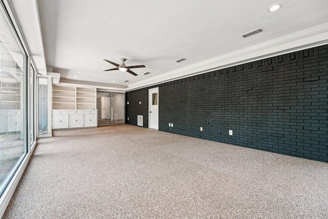 3806 Las Cienega Blvd, Temple, TX 76502 - carpeted spare room with brick wall, ceiling fan, and recessed lighting