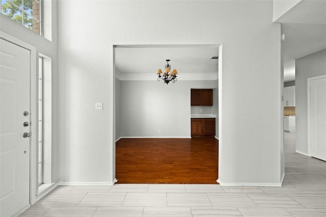 1217 Dove Cir, Cedar Park, TX 78613 - foyer entrance featuring a chandelier and crown molding