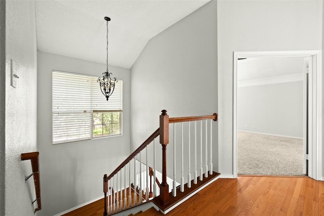 1217 Dove Cir, Cedar Park, TX 78613 - stairway with a chandelier, vaulted ceiling, and wood finished floors