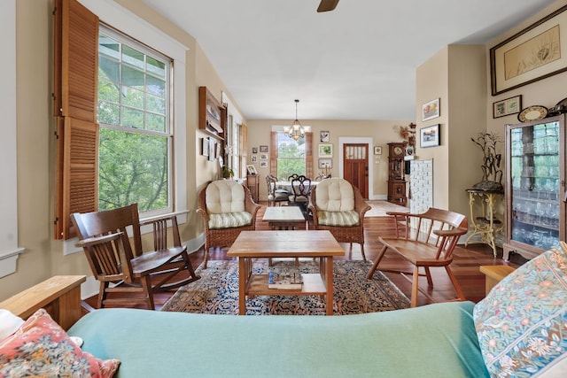 1110 Travis Heights Blvd, Austin, TX 78704 - living room featuring a chandelier, wood finished floors, and ceiling fan
