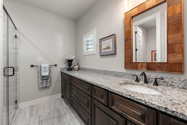 105 Clear Springs Ct, Marble Falls, TX 78654 - full bathroom featuring vanity, a shower stall, and marble look tiles