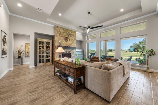 105 Clear Springs Ct, Marble Falls, TX 78654 - living room with a fireplace, ceiling fan, light wood-type flooring, recessed lighting, and ornamental molding
