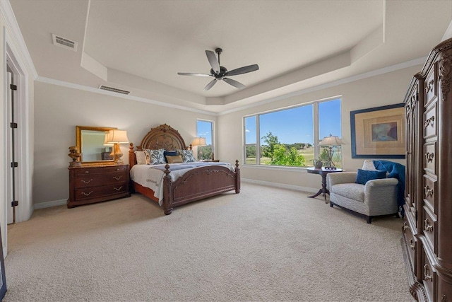 105 Clear Springs Ct, Marble Falls, TX 78654 - bedroom with a raised ceiling, light carpet, ceiling fan, and crown molding